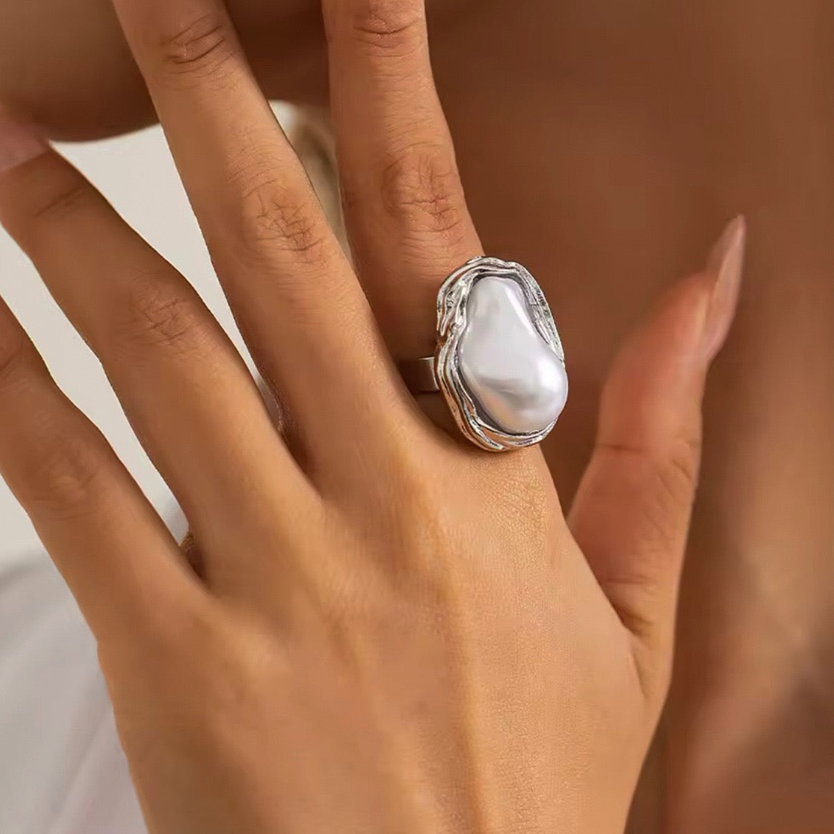 Big pearly statement rings