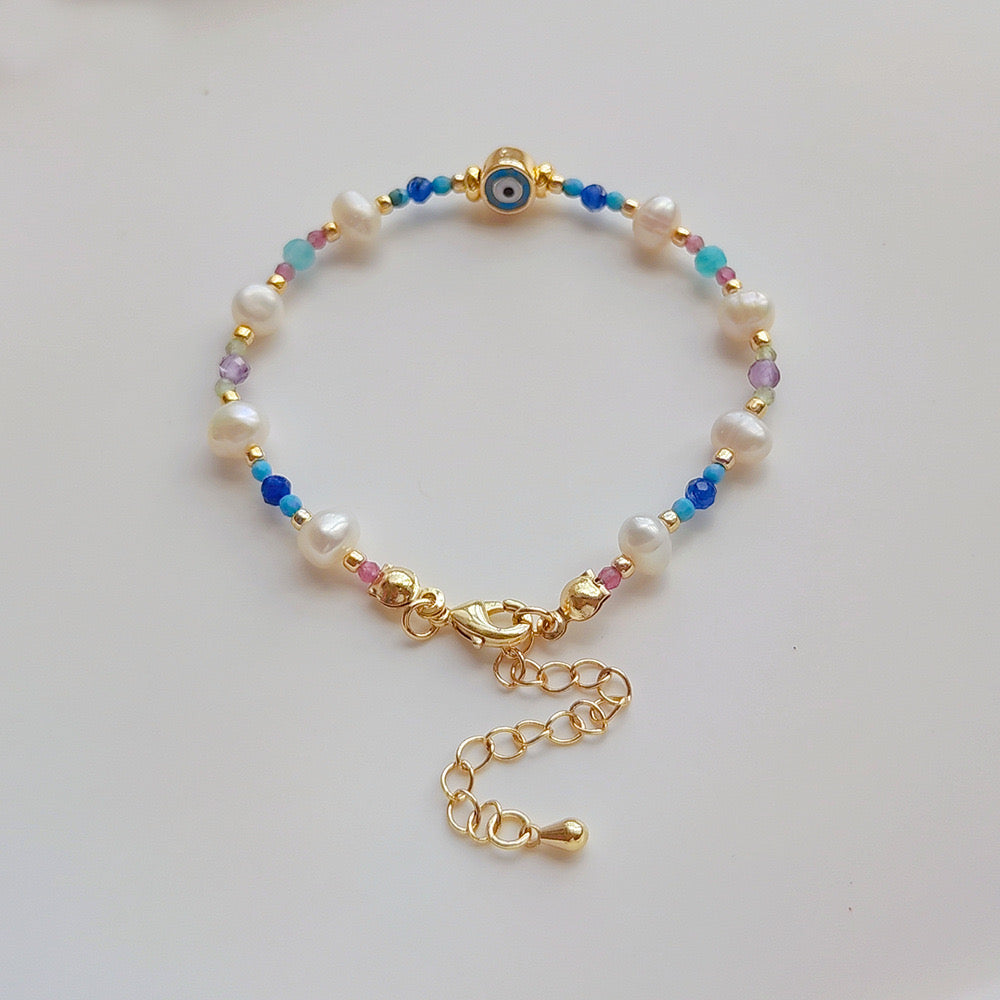 Evil eye pearl and natural stones bracelet