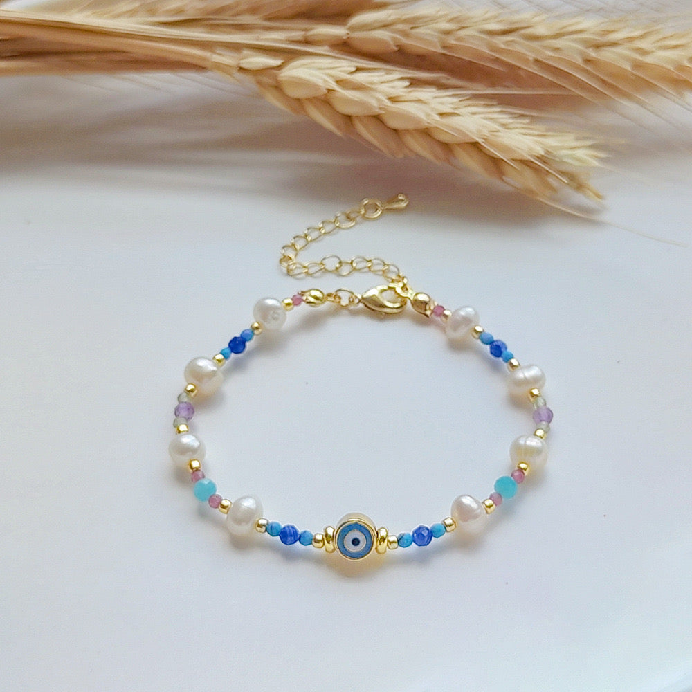 Evil eye pearl and natural stones bracelet