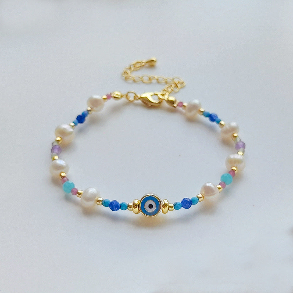 Evil eye pearl and natural stones bracelet