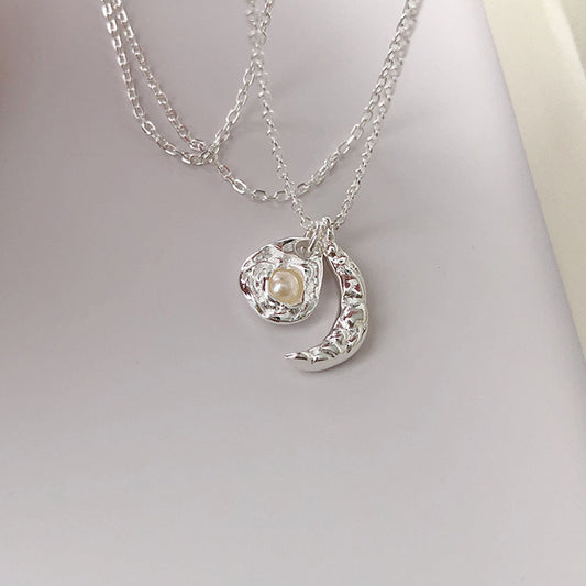 Sterling silver pearl moon and sun necklace